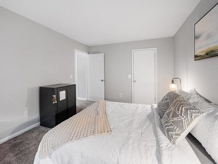 carpeted bedroom at Rising Estates Apartments